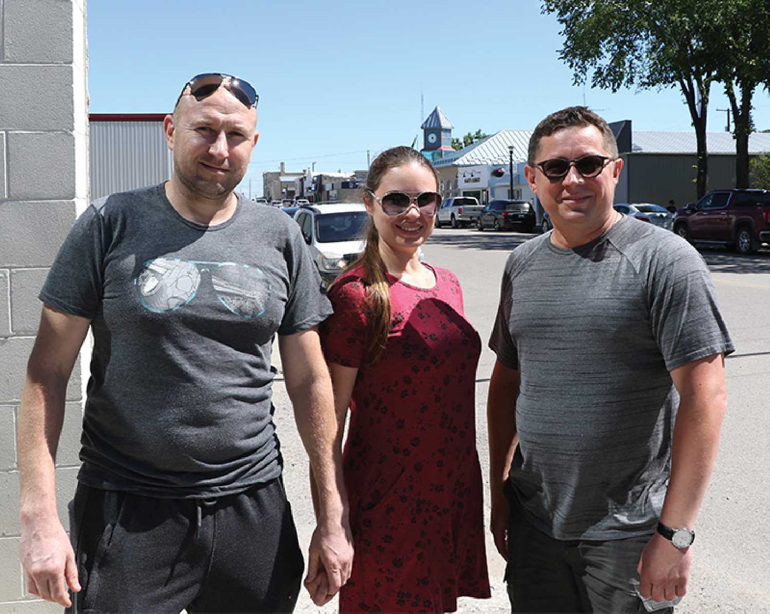 Roman and Julia Marynets, who arrived in Moosomin from Ukraine last week, with Roman Chernykh of the local Ukrainian community, at right.